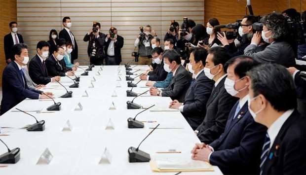 Japan's Prime Minister Shinzo Abe speaks during a meeting about the measures against the coronavirus disease (COVID-19), at the prime minister official residence in Tokyo