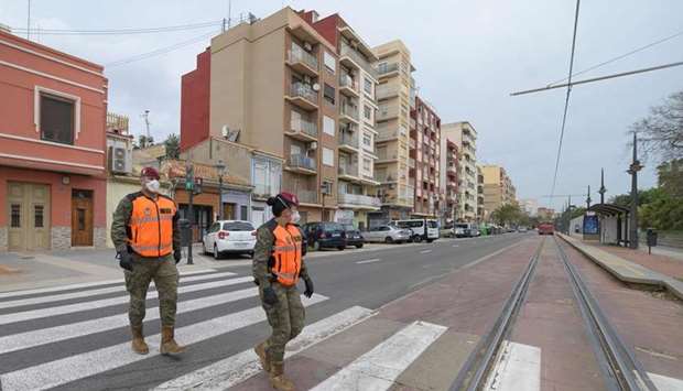 Spanish soldiers patrol the streets of Valencia on April 7, 2020 during a national lockdown to prevent the spread of the Covid-16 outbreak