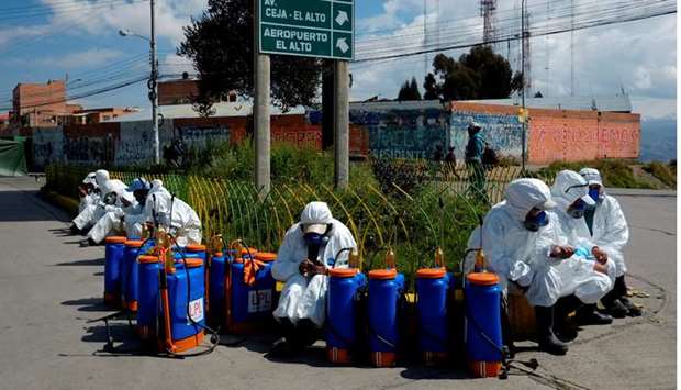 A brigade of volunteers await an assignment to sanitise an area amid the coronavirus outbreak, in El Alto, on the outskirts of La Paz, Bolivia, yesterday.