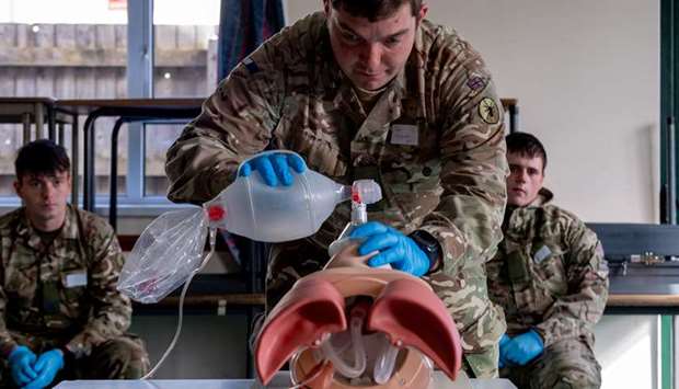 A Royal Signals soldier practices skills acquired during training, as the army trains 60 soldiers to prepare to support the Welsh Ambulance Service NHS Trust (WAST) in the battle against the coronavirus disease, in Wales, Britain, yesterday.