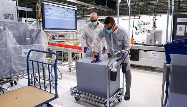 Employees work on the production of medical ventilators at the factory of Spanish automobile manufacturer SEAT in Martorell near Barcelona