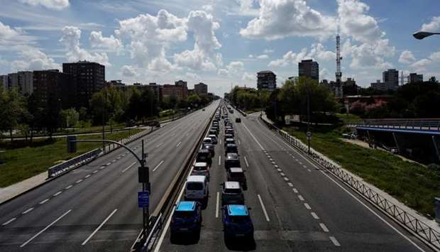 Vehicles queue as a police control takes place at the A-42 motorway during the coronavirus disease (Covid-19) outbreak, in Madrid, Spain