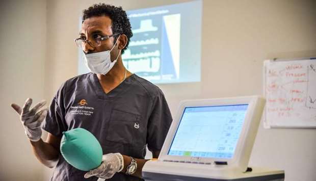 Habtamu Kehali, a trainer of mechanical ventilators, provides training for doctors on how to use mechanical ventilators for the Covid-19 coronavirus patients at the American Medical Center(AMC) in Addis Ababa, Ethiopia