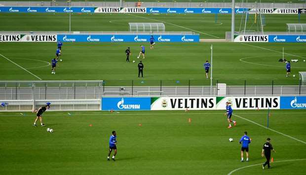 FC Schalke players take part in a training session at the clubu2019s training ground in Gelsenkirchen, Germany, yesterday. (AFP)