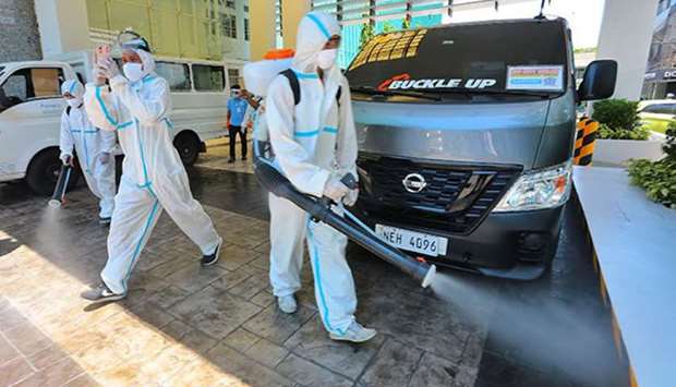 A sanitation team disinfects the Jose Reyes Memorial Hospital in Manila.