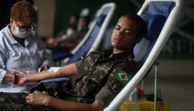An army officer donates blood through the haematology institute Hemorio, in an effort to bolster the blood supply, during the coronavirus disease outbreak, at the army forces headquarter in Rio de Janeiro, Brazil, yesterday.