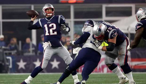 File photo of Tom Brady (left) in action during a playoff game against the Tennessee Titans at Gillette Stadium. PICTURE: USA TODAY Sports