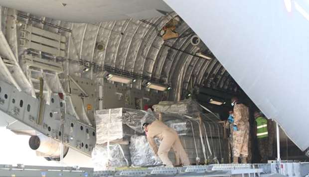 Aid materials being unloaded from Qatar Amiri Air Force aircraft in Italy on Wednesday.