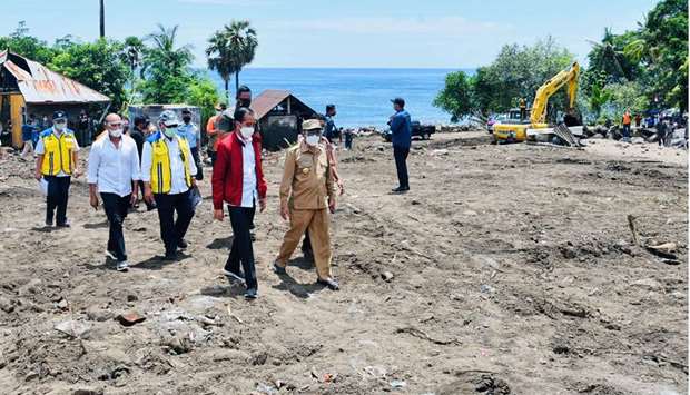 Indonesian President Joko Widodo visits an area affected by flash floods triggered by a tropical cyclone Seroja in East Flores, East Nusa Tenggara province, Indonesia
