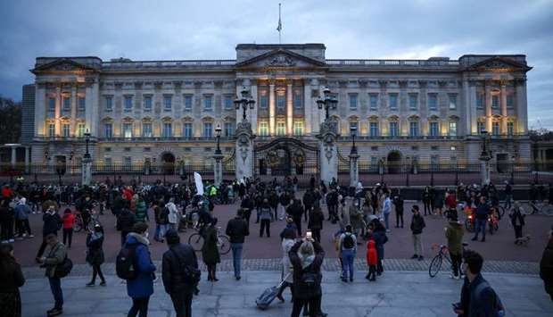 People gather outside Buckingham Palace after Britain's Prince Philip, husband of Queen Elizabeth, died at the age of 99, in London