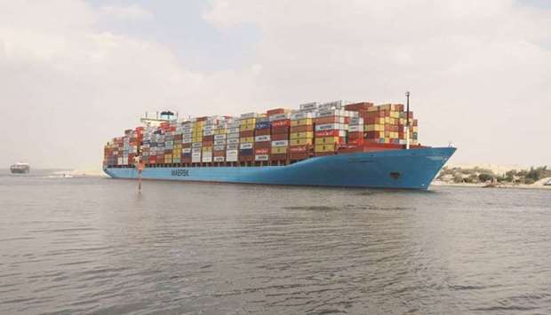 A container ship sails at the Suez Canal, in Ismailia, Egypt yesterday.