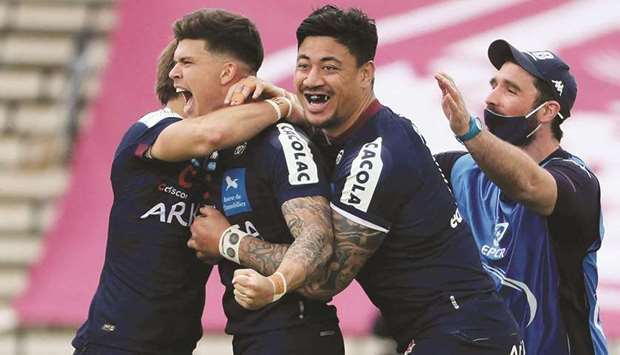 Bordeauxu2019 French fly half Matthieu Jalibert (2nd L) and teammates celebrate their victory over Racing 92 at Chaban-Delmas stadium in Bordeaux yesterday.