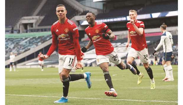 Manchester Unitedu2019s Mason Greenwood celebrates scoring their third goal with Aaron Wan-Bissaka and Scott McTominay in London yesterday.