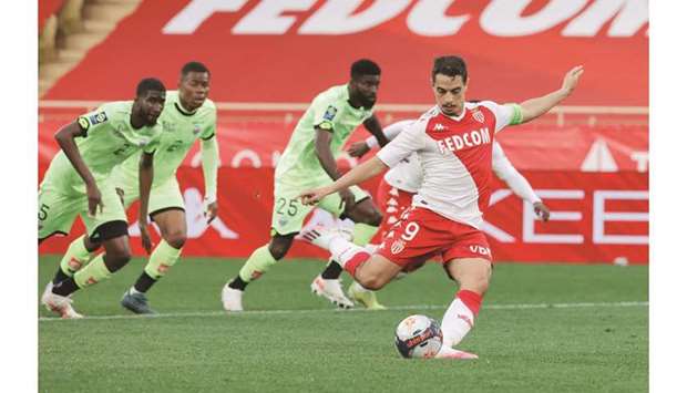 AS Monacou2019s Wissam Ben Yedder scores a goal from the penalty spot during the Ligue 1 match against Dijon in Monaco yesterday. (Reuters)