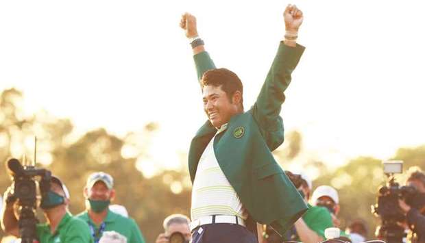 Hideki Matsuyama of Japan celebrates during the Green Jacket ceremony after winning the Masters at Augusta National Golf Club on Sunday.
