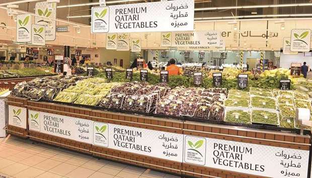 Premium Qatari vegetables on display at an outlet.rnrn