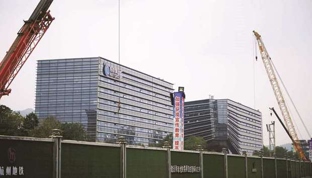 Ant Group headquarters in Hangzhou. China told Ant to become a financial holding company that will be regulated more like a bank, directing an overhaul that was set in motion when the fintech giantu2019s record initial public offering was abruptly halted last year.