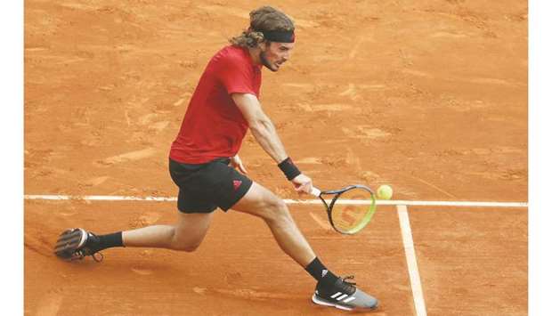 Greeceu2019s Stefanos Tsitsipas returns the ball to Russiau2019s Aslan Karatsev during their second round singles match on day three of the Monte-Carlo ATP 1000 Masters Series tennis tournament in Monte-Carlo, Monaco, yesterday. (AFP)
