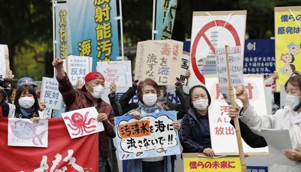 People rally to protest against the Japanese government's decision to discharge contaminated radioactive wastewater from Fukushima Daiichi nuclear power plant into the sea, in front of the Fukushima prefectural government headquarters in Fukushima,