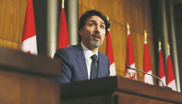 Canadian Prime Minister Justin Trudeau addresses a news conference in Ottawa yesterday as efforts continue to help slow the spread of coronavirus. (Reuters)