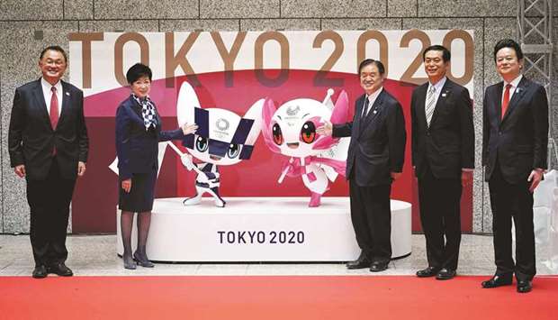 (From left) Japan Olympic Committee president Yasuhiro Yamashita, Tokyo Governor Yuriko Koike, Tokyo 2020 organising committee vice-president Toshiaki Endo, Tokyo Metropolitan Assembly President Ryoichi Ishikawa and Kunihiko Koyama, chairperson of special committee on measures to promote the Olympic and Paralympic Games of Tokyo Metropolitan Assembly, pose with the statues of Miraitowa and Someity, the official mascots for the Tokyo Olympic and Paralympics Games yesterday. (AFP)