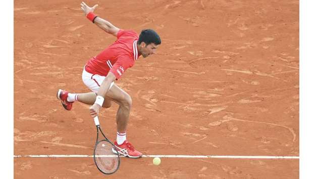 Serbiau2019s Novak Djokovic returns the ball during his second round singles match against Italyu2019s Jannik Sinner (not pictured) at the Monte Carlo Masters yesterday. (AFP)