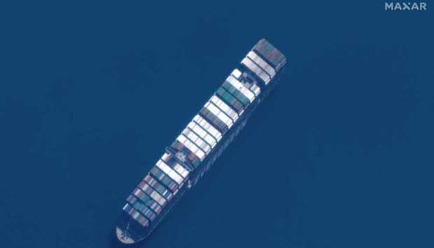 This satellite imagery released by Maxar Technologies shows a close up overview of the MV Ever Given container ship in the Great Bitter Lake area of the Suez Canal on April 12, 2021. AFP/Satellite image u00a92021 Maxar Technologies.