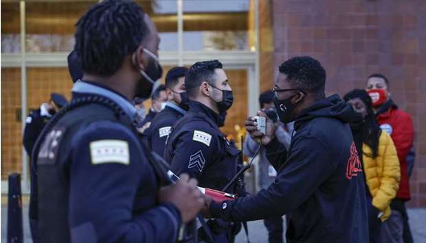 Chicago activist Ja'Mal Green (R) shouts outside the Chicago Police headquarters during a rally in Chicago, Illinois.