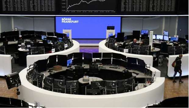 Traders work at the Frankfurt Stock Exchange. The DAX 30 closed up 1.3% to 15,459.75 points yesterday.