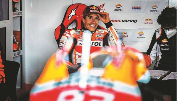 Repsol Honda Teamu2019s Spanish rider Marc Marquez smiles in the team garage during the first MotoGP free practice session for the Portuguese Grand Prix in Portimao yesterday. (AFP)