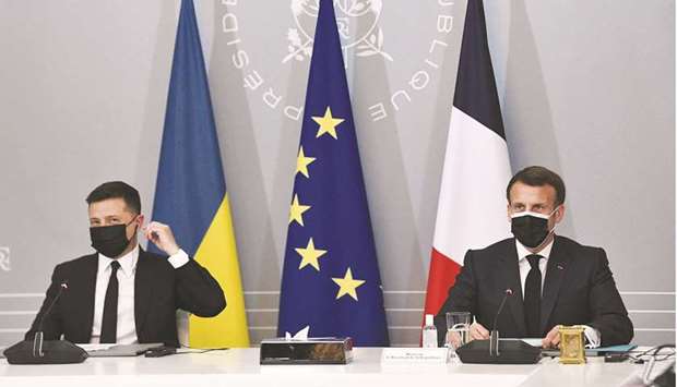French President Emmanuel Macron and Ukrainian President Volodymyr Zelenskiy hold a news conference following their meeting at the Elysee Palace in Paris, yesterday.