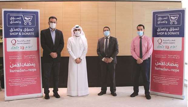 Officials mark the partnership between Qatar Charity and LuLu Hypermarket Qatar.rnrn