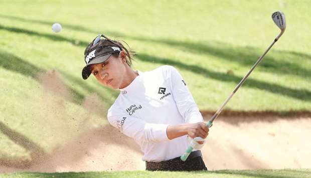 Lydia Ko of New Zealand chips out of the bunker during the third round of the LPGA LOTTE Championship at Kapolei Golf Club in Kapolei, Hawaii.