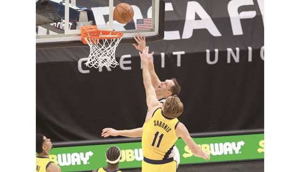 Utah Jazz forward Bojan Bogdanovic (in background) shoots the ball against Indiana Pacers forward Domantas Sabonis during the second-half of their NBA game at Vivint Smart Home Arena in Salt Lake City. (USA TODAY Sports)