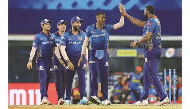 Hardik Pandya of Mumbai Indians (second from right) celebrates the run out of Sunrisers Hyderabadu2019s David Warner with his teammates during their IPL match at the MA Chidambaram Stadium in Chennai yesterday. (Sportzpics for IPL)