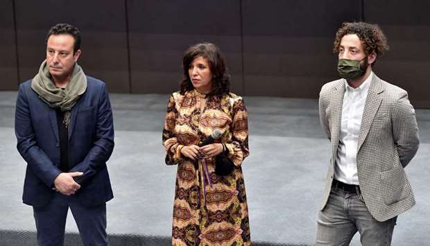 Tunisian director and screenwriter Kaouther Ben Henia (C), producer Mohamed Habib Attia (L), and Syrian actor Yahya Mahayni, attend the first screening of her film ,The man who sold his skin, in the country, in the capital Tunis