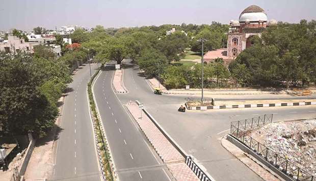 Roads lie deserted during a lockdown imposed by the government amidst rising Covid-19 cases in New Delhi yesterday.
