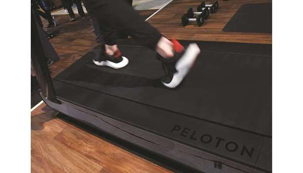 This file photo shows the running deck of a Peloton treadmill.