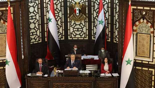  Syrian parliament speaker Hamouda Sabbagh (C) announces that presidential elections in the war-torn country will be held on May 26. (AFP) 