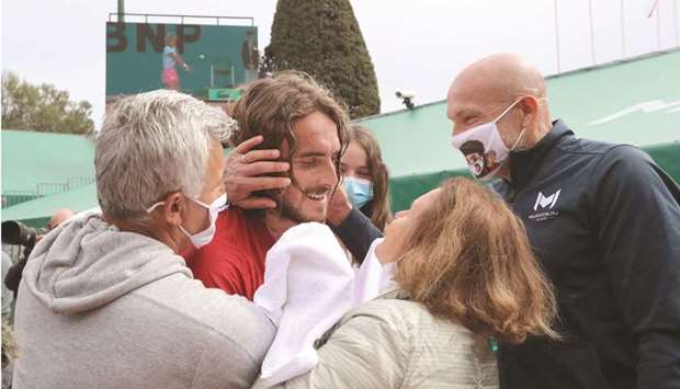 Greeceu2019s Stefanos Tsitsipas (centre) celebrates with his parents and family members after winning the Monte-Carlo ATP Masters Series in Monaco. (AFP)