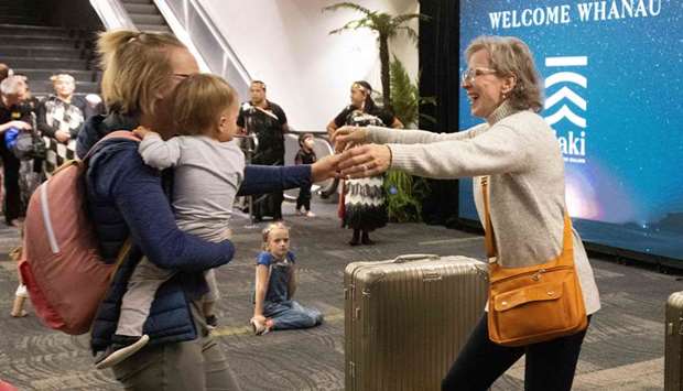 Families are reunited as travellers arrive on the first flight from Sydney, in Wellington  as Australia and New Zealand opened a trans-Tasman quarantine-free travel bubble.