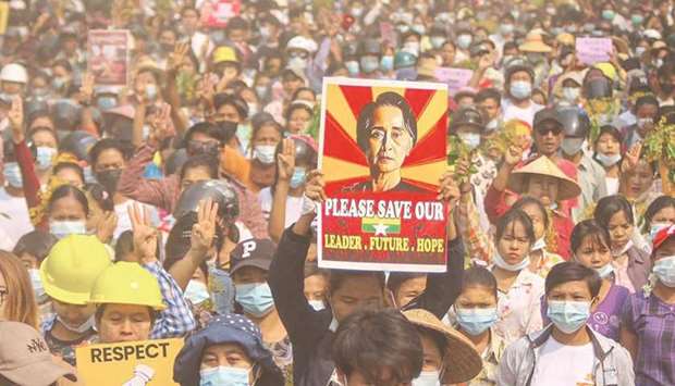 This photo received via Facebook yesterday shows a protester holding up a poster featuring detained civilian leader Aung San Suu Kyi during a demonstration against the military coup in Monywa, Sagaing region.