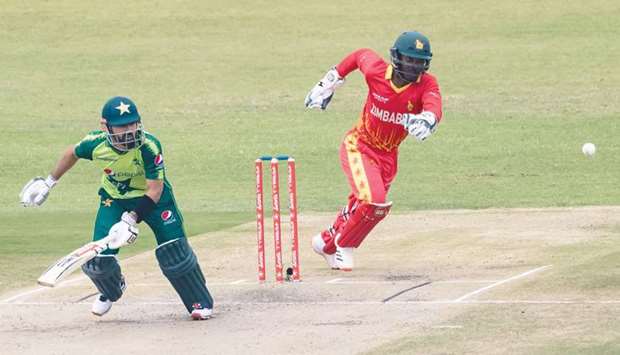 Pakistanu2019s Mohamed Rizwan (left) takes a run during the first Twenty20 international at the Harare Sports Club yesterday. (AFP)