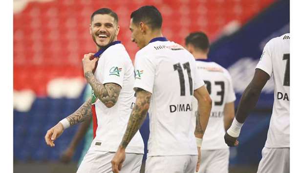 Paris Saint-Germainu2019s forward Mauro Icardi (left) smiles after scoring his teamu2019s fourth goal during the French Cup quarter-final match against Angers in Paris yesterday. (AFP)