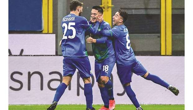 Sassuolou2019s Giacomo Raspadori (centre) celebrates with teammates after scoring against AC Milan in Milan yesterday. (AFP)