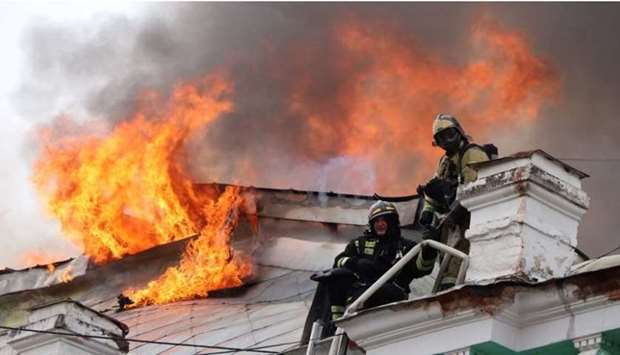 Firefighters work to extinguish a fire at a local clinic of cardiac surgery in the city of Blagoveshchensk, Russia.  Russian Emergencies Ministry/Handout via REUTERS