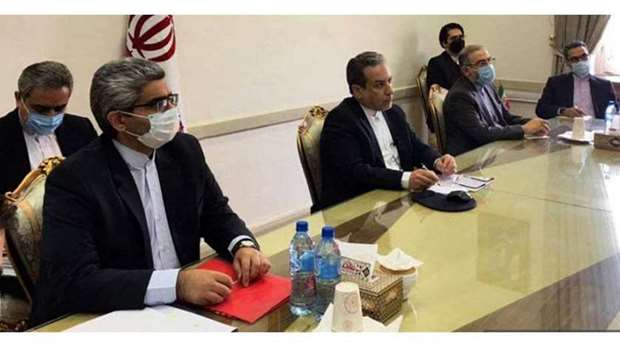 A handout picture provided by the Iranian Foreign Ministry on April 2, 2021 shows Iran' deputy Foreign Abbas Araghchi (C) attends a virtual meeting with the Joint Commission on Iran's nuclear program (JCPOA) in Tehran. AFP/HO/Iranian Foreign Ministry