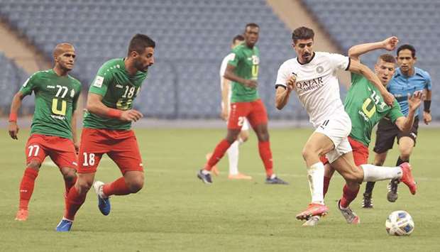 Sadd's forward Baghdad Bounedjah (2nd-R) passes the ball during the AFC Champions League group D match between Qatar's Al-Sadd and Jordan's Al-Wehdat on April 20, 2021, at the King Fahd International Stadium in the Saudi capital, Riyadh.