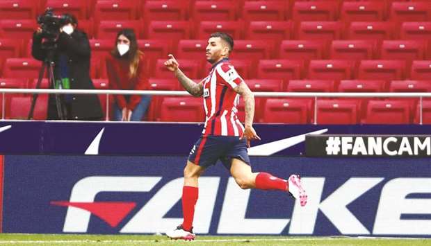 Atletico Madridu2019s Angel Correa celebrates his goal during the match against Huesca in Madrid, Spain, yesterday. (Reuters)