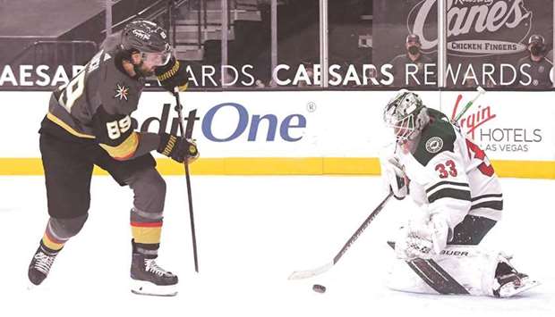 Cam Talbot (right) of the Minnesota Wild blocks a shot by Alex Tuch of the Vegas Golden Knights during the game at T-Mobile Arena in Las Vegas, Nevada, United States, on Thursday. (AFP)